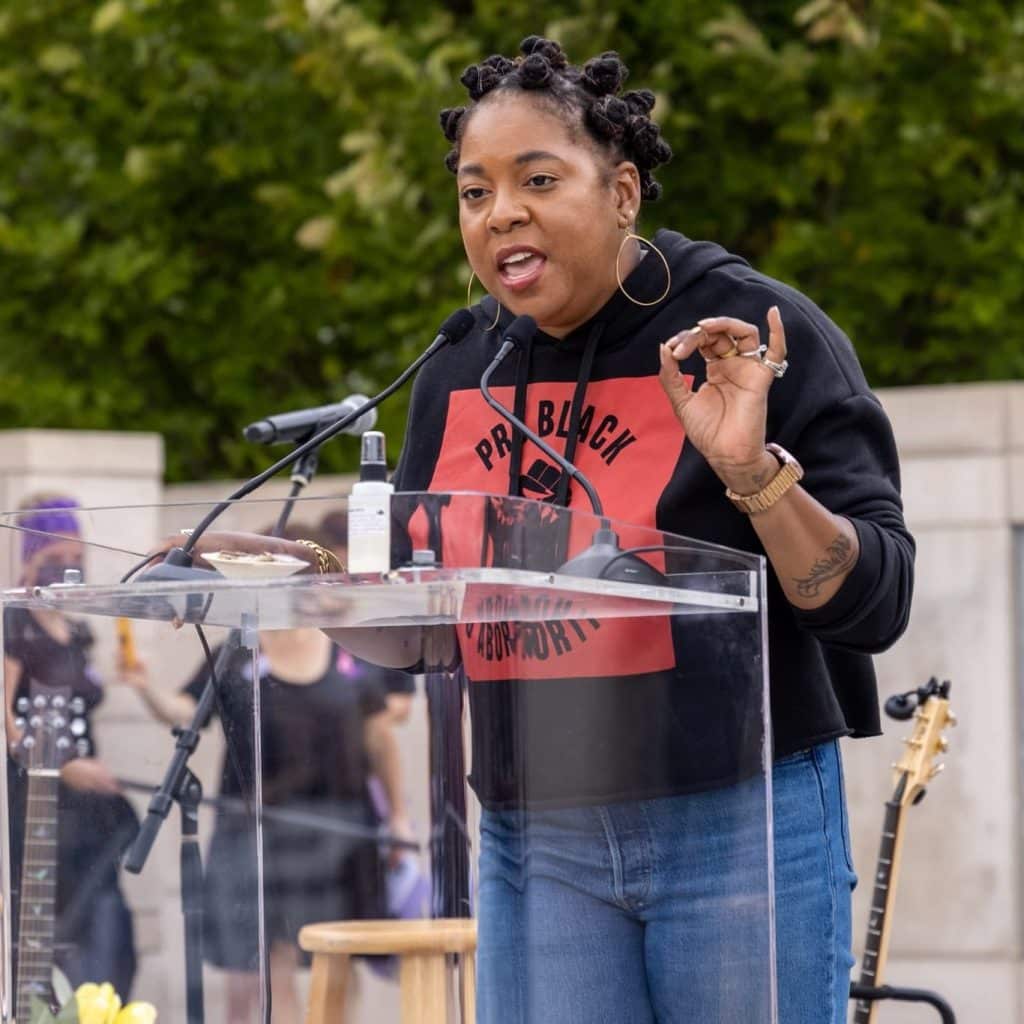 Kwajelyn Jackson speaking at the podium during the Rally and March for Reproductive Justice in October 2021