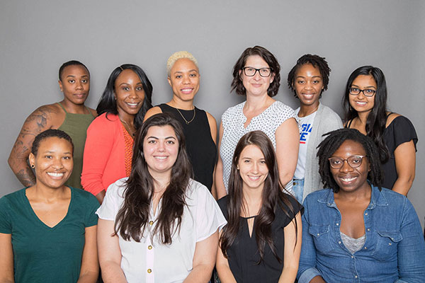 Participants in the Errin J. Vuley Fellows Program pose for a photo at the clinic.