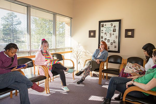 Models pose as patients in the Feminist Women’s Health Center waiting area.